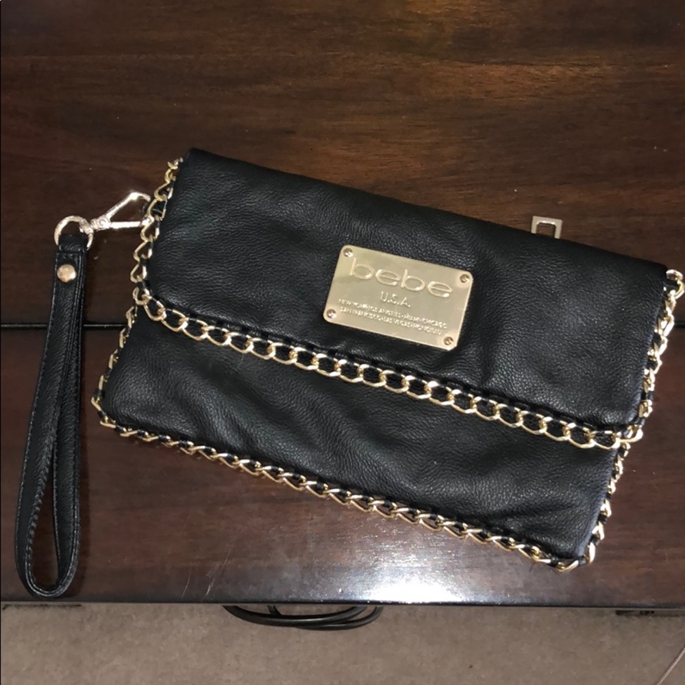 Bebe black clutch with gold